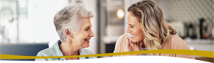 Senior woman and adult child discussing assisted living communtiies Senior woman and adult child discussing assisted living communtiies
